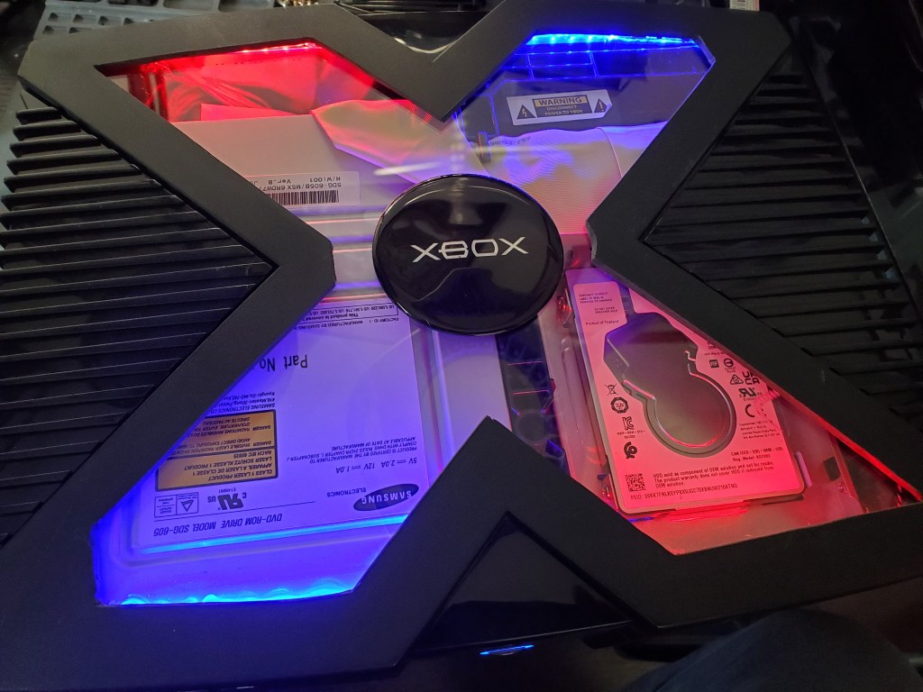 Custom modded original Xbox with windows, LEDs, and mod chip installation.